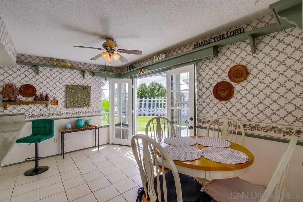 13590 Freeport Road San Diego, CA 92129 - Photo 22 of 58 a dining room with furniture and window