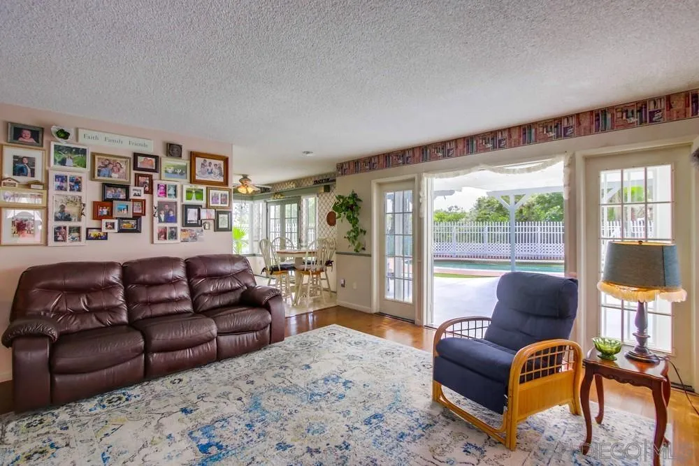 13590 Freeport Road San Diego, CA 92129 - Photo 25 of 58 a living room with furniture or couch and a large window