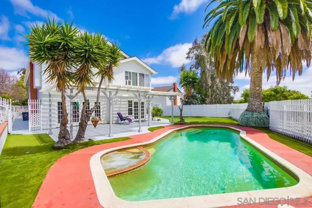 13590 Freeport Road San Diego, CA 92129 - Photo 3 of 58 a swimming pool with outdoor seating and yard