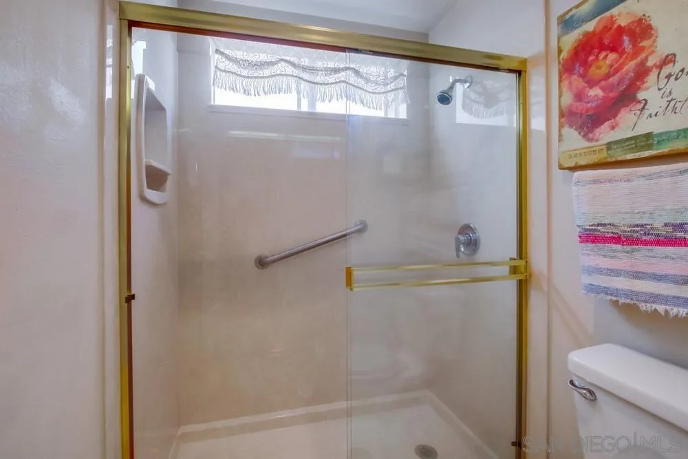 13590 Freeport Road San Diego, CA 92129 - Photo 32 of 58 a bathroom with a shower and a toilet