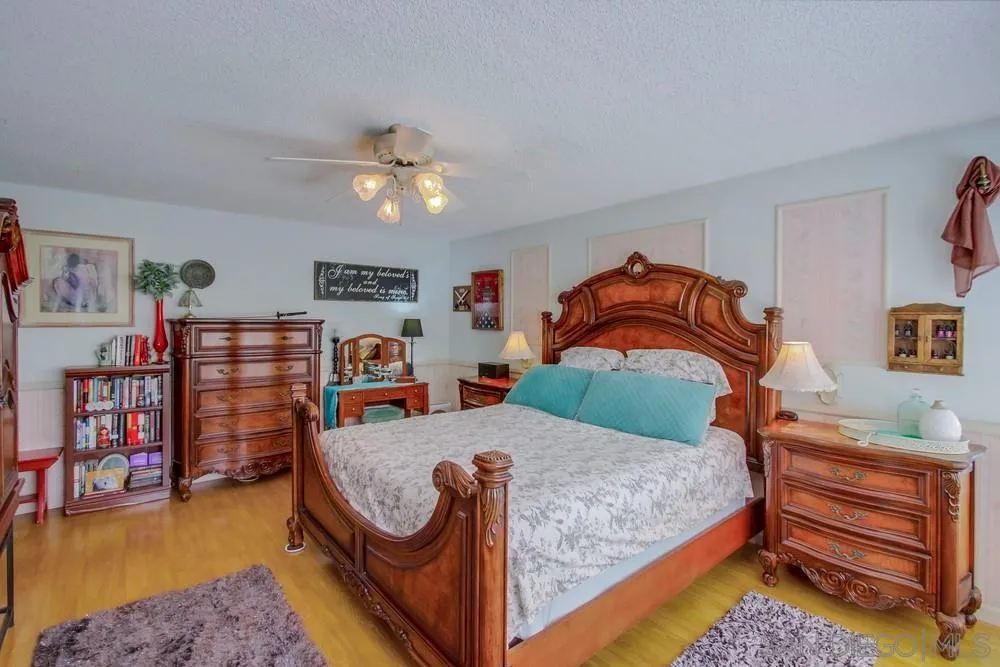 13590 Freeport Road San Diego, CA 92129 - Photo 36 of 58 a bedroom with a bed and dresser