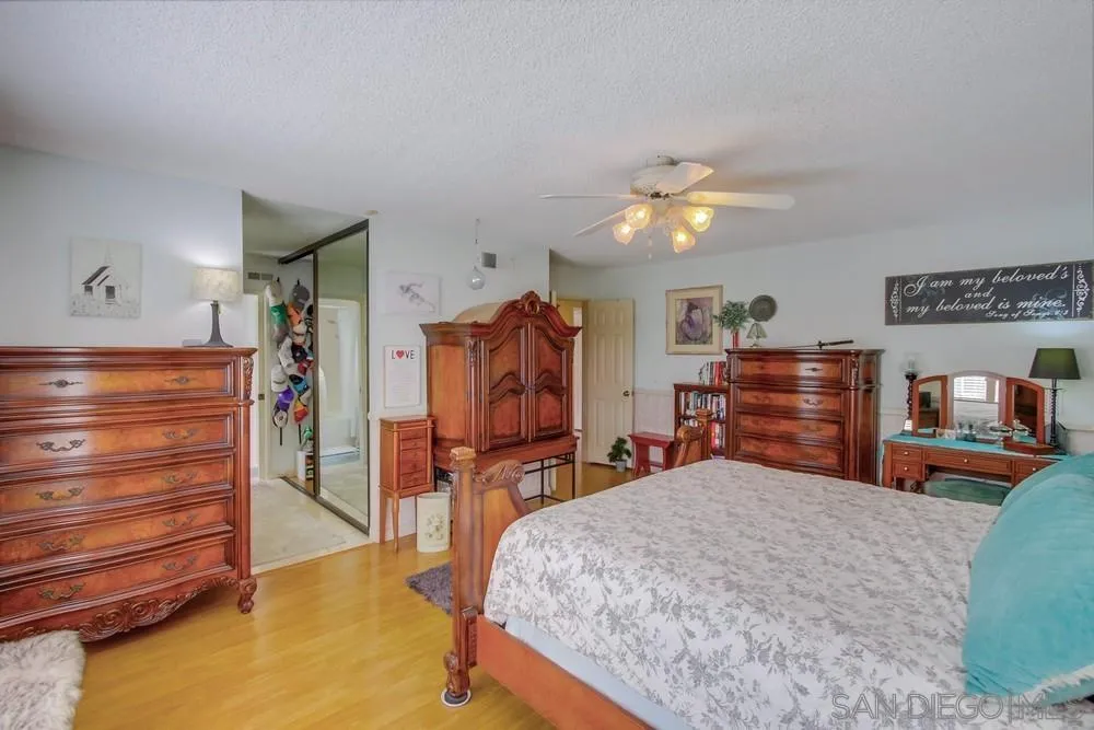 13590 Freeport Road San Diego, CA 92129 - Photo 38 of 58 a bedroom with a bed and furniture