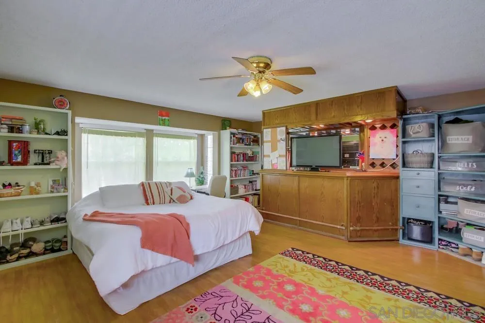 13590 Freeport Road San Diego, CA 92129 - Photo 46 of 58 a bedroom with a bed dresser and a window