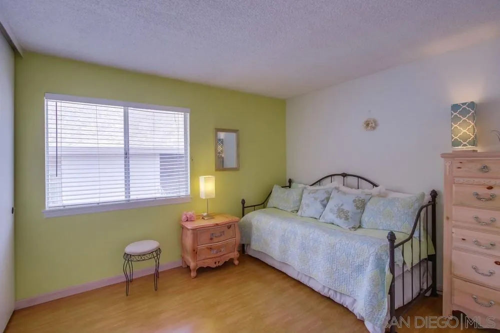 13590 Freeport Road San Diego, CA 92129 - Photo 49 of 58 a bedroom with a bed and a window