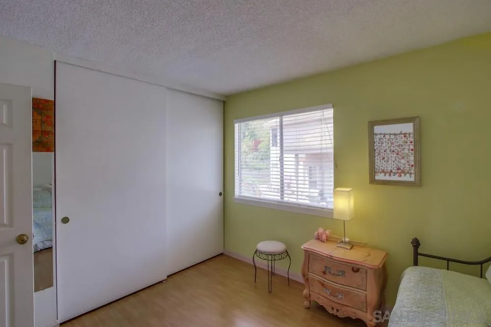 13590 Freeport Road San Diego, CA 92129 - Photo 50 of 58 a bedroom with a bed and a window