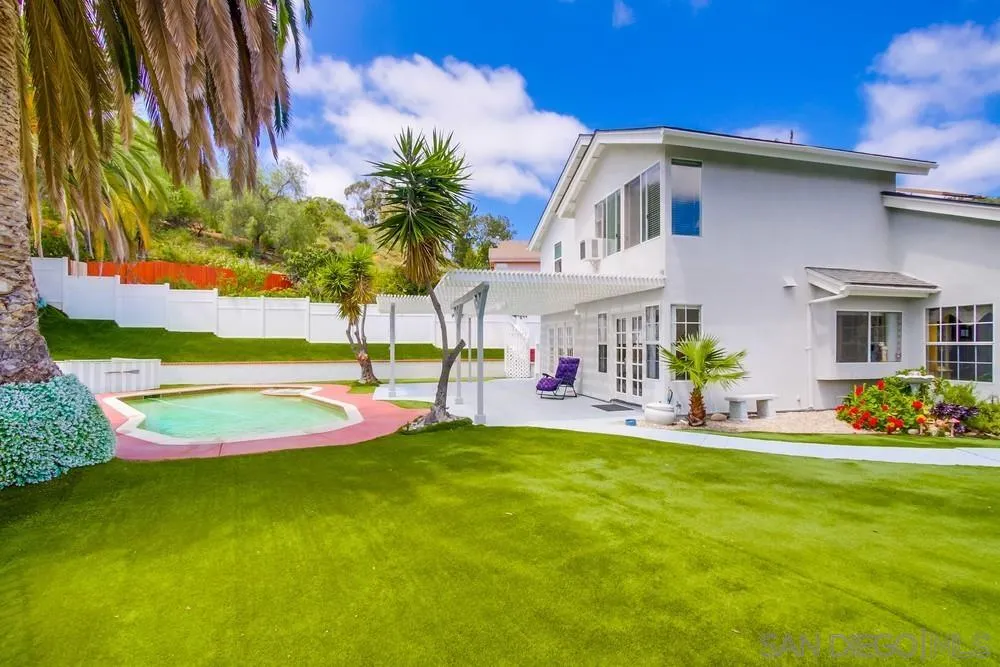 13590 Freeport Road San Diego, CA 92129 - Photo 5 of 58 a front view of house with yard and outdoor seating