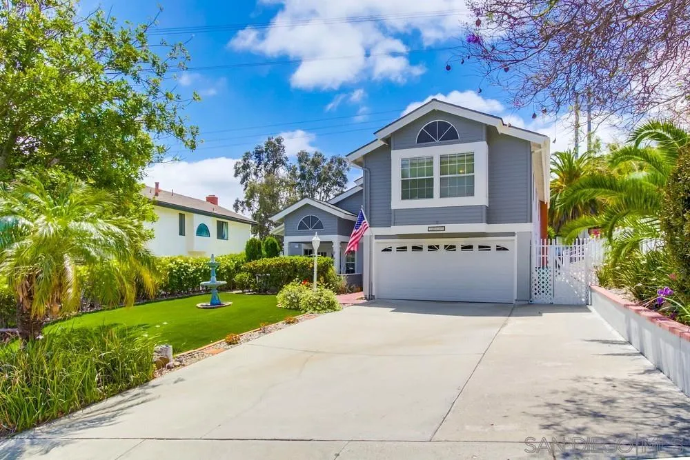 13590 Freeport Road San Diego, CA 92129 - Photo 58 of 58 a front view of a house with a yard and garage