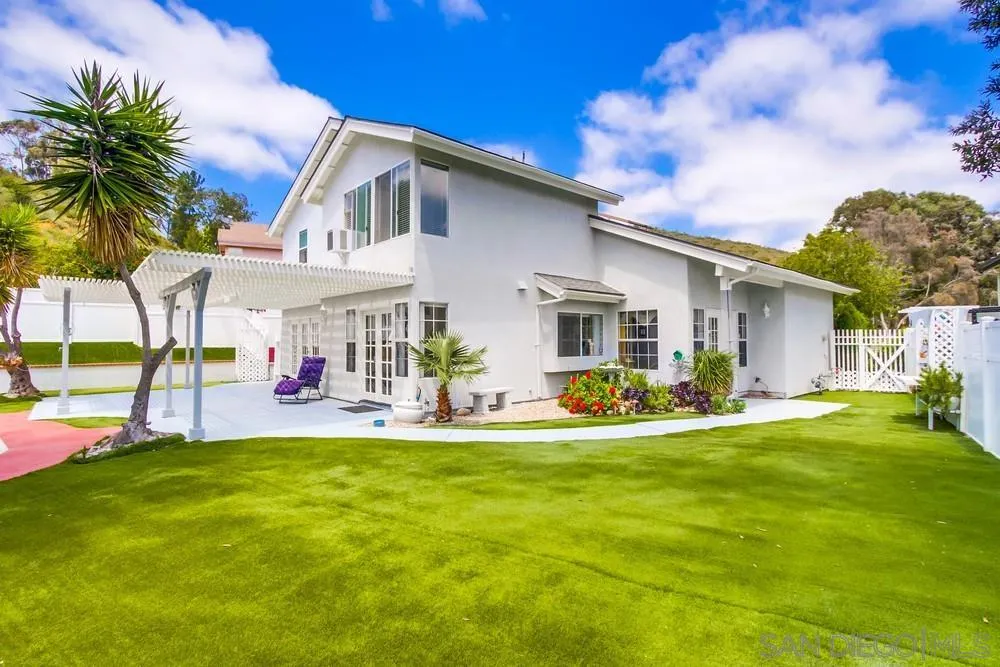 13590 Freeport Road San Diego, CA 92129 - Photo 6 of 58 a front view of house with yard outdoor seating and green space
