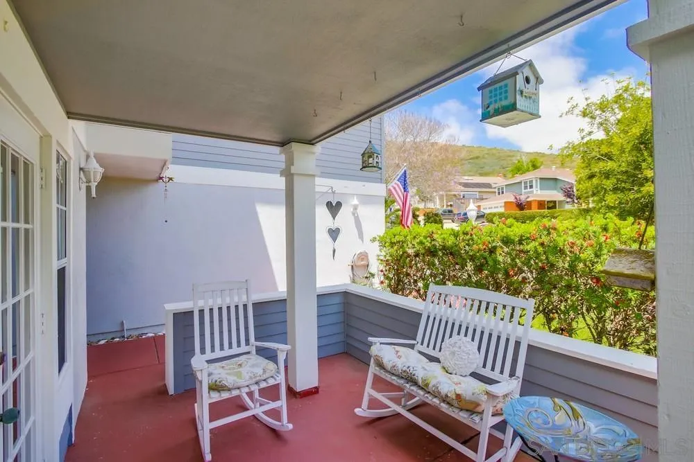 13590 Freeport Road San Diego, CA 92129 - Photo 8 of 58 a view of a porch with a bench