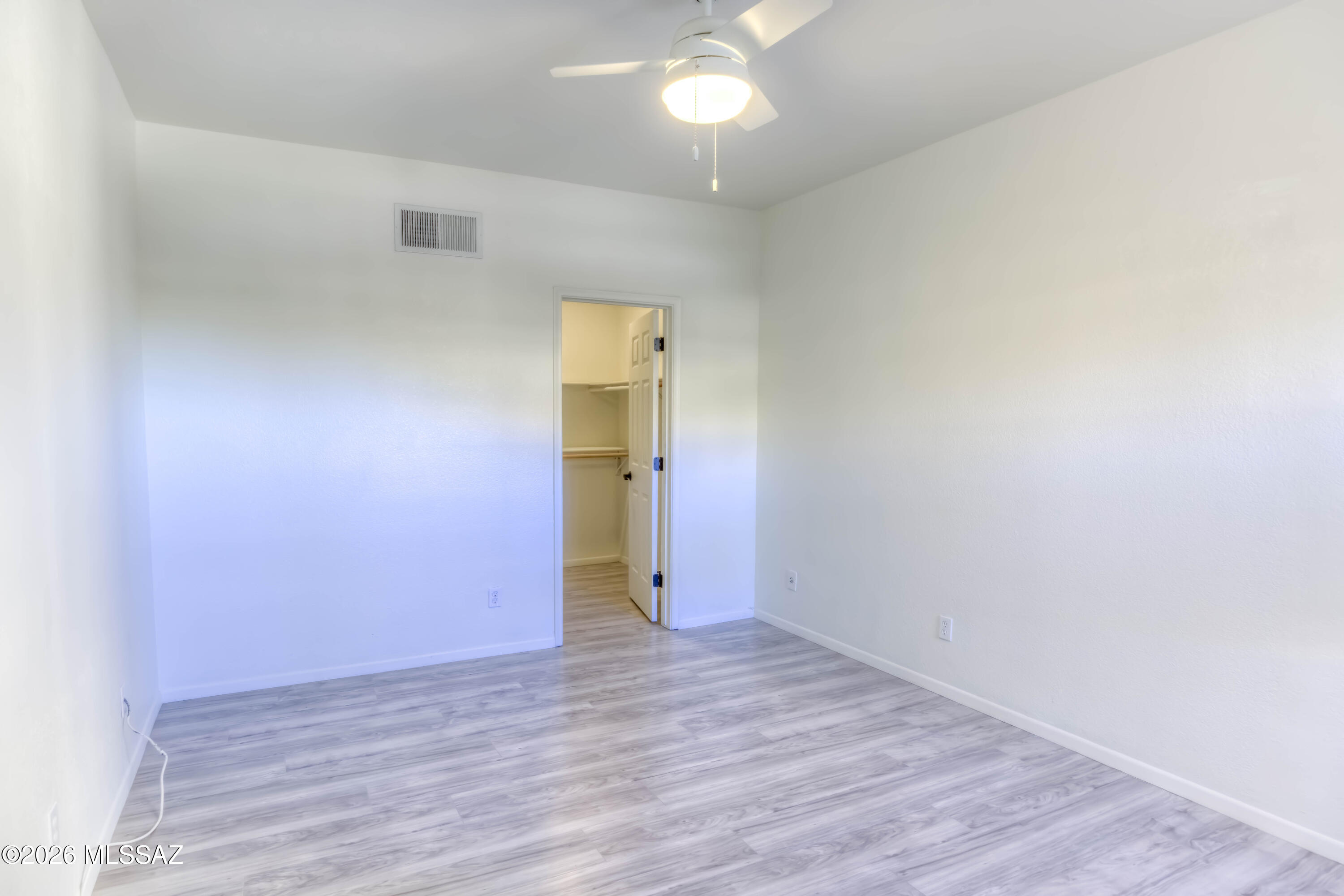 5500 North Valley View Road, Unit 123 Tucson, AZ 85718 - Photo 21 of 36 wooden floor in an empty room