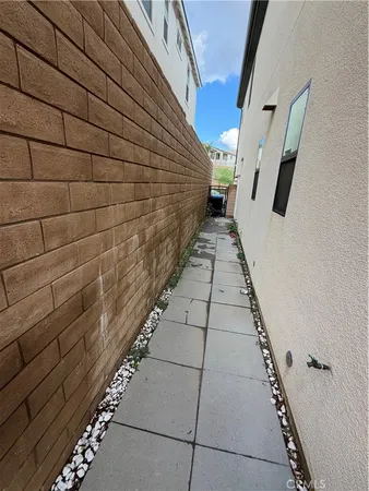 a path view of a house with stairs