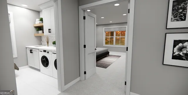 a view of a hallway with washer and dryer