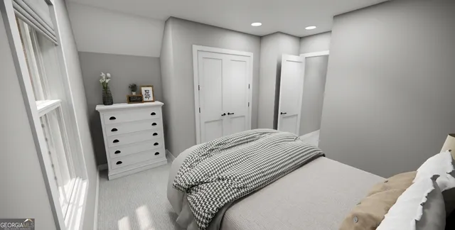 a bedroom with a bed and cabinets