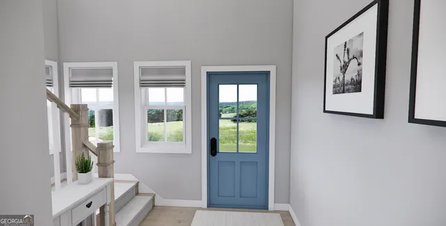 a view of an entryway with wooden floor