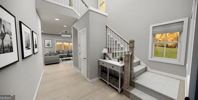 a view of a livingroom with furniture and staircase