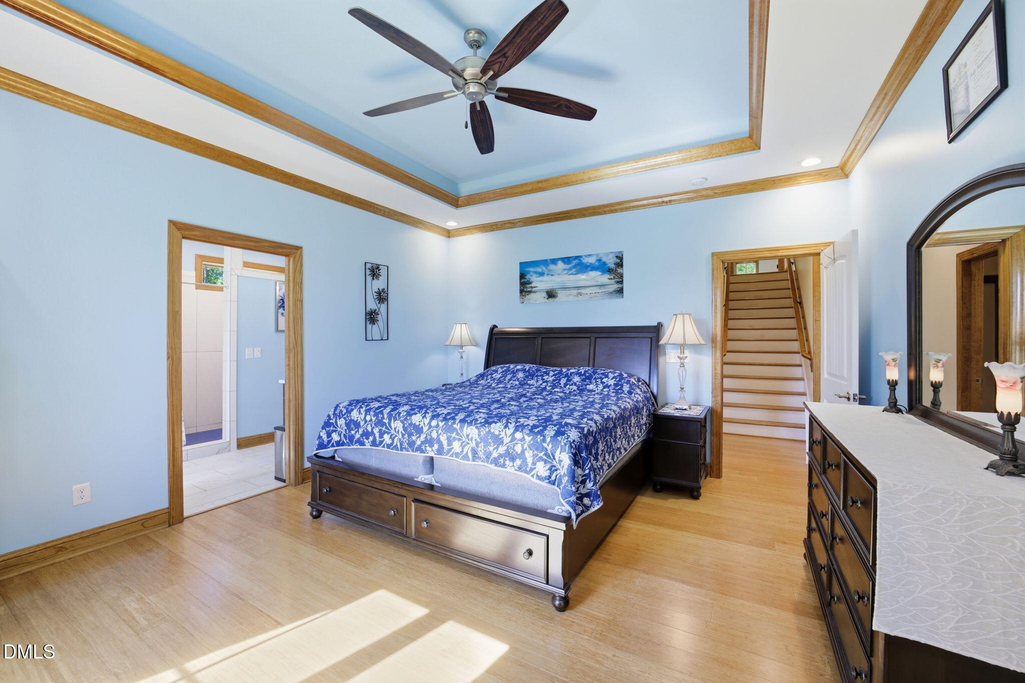 35 North Rippling Court Smithfield, NC 27577 - Photo 22 of 59 a bedroom with a bed and a chandelier