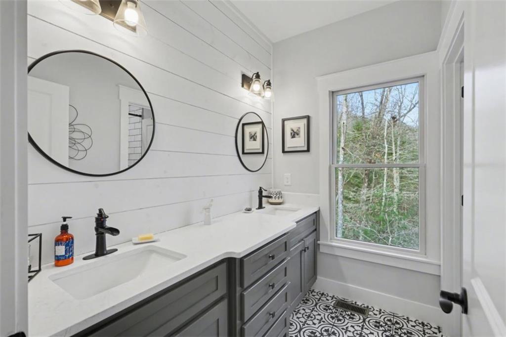 452 Chestnut Mountain Road Blairsville, GA 30512 - Photo 17 of 77 a bathroom with a sink and a mirror