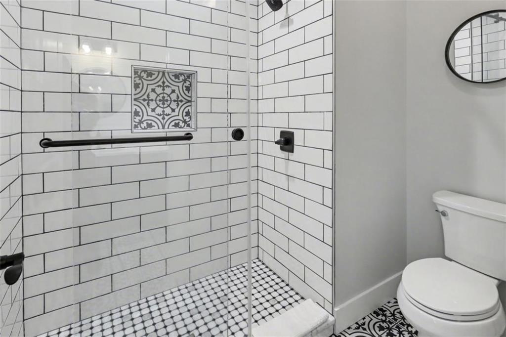452 Chestnut Mountain Road Blairsville, GA 30512 - Photo 18 of 77 a bathroom with a toilet and a shower