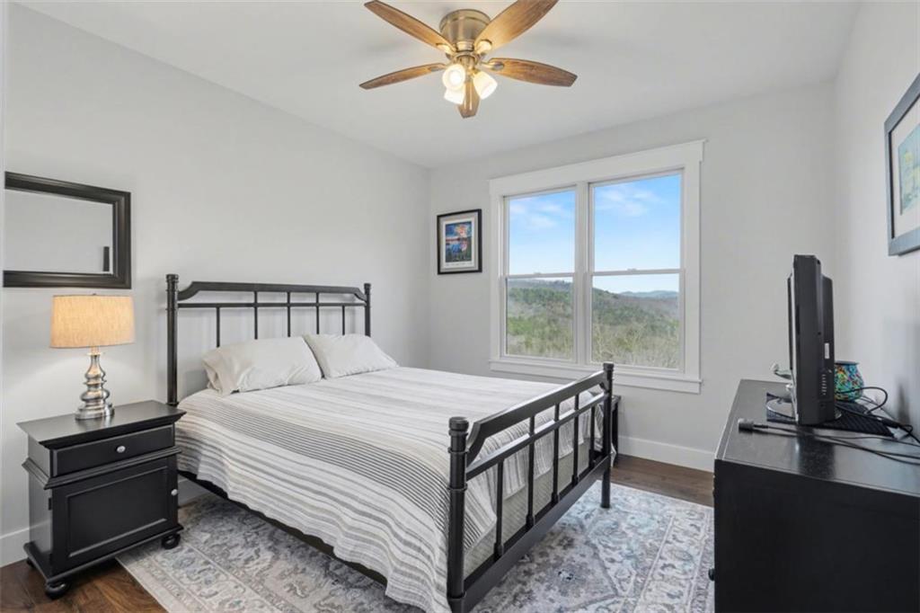 452 Chestnut Mountain Road Blairsville, GA 30512 - Photo 20 of 77 a bedroom with a bed and window