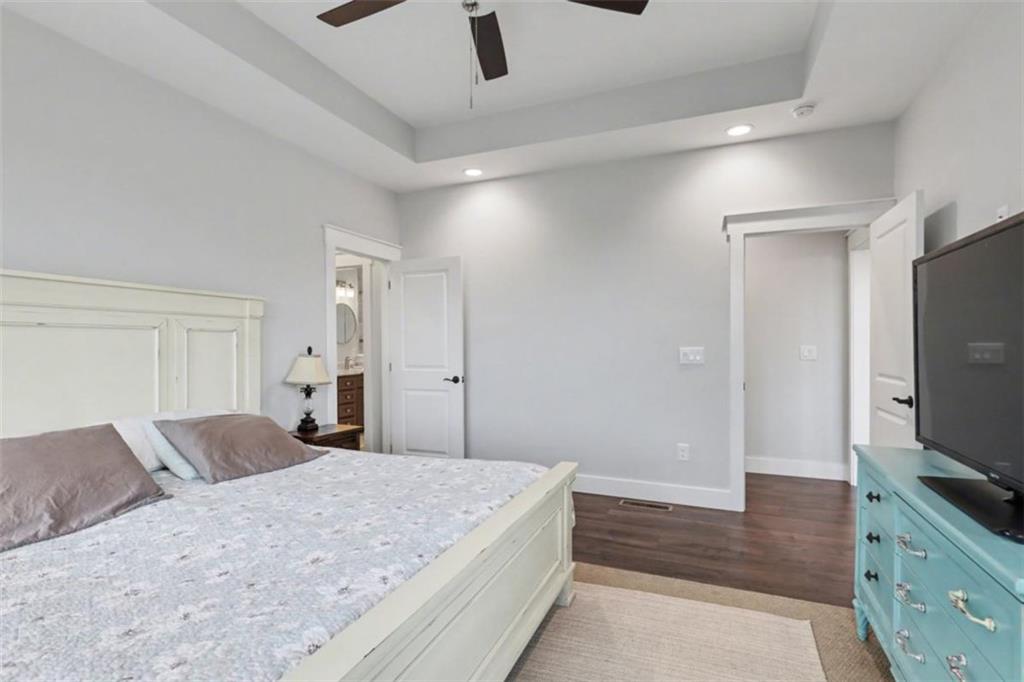 452 Chestnut Mountain Road Blairsville, GA 30512 - Photo 39 of 77 a bedroom with a bed and a flat screen tv