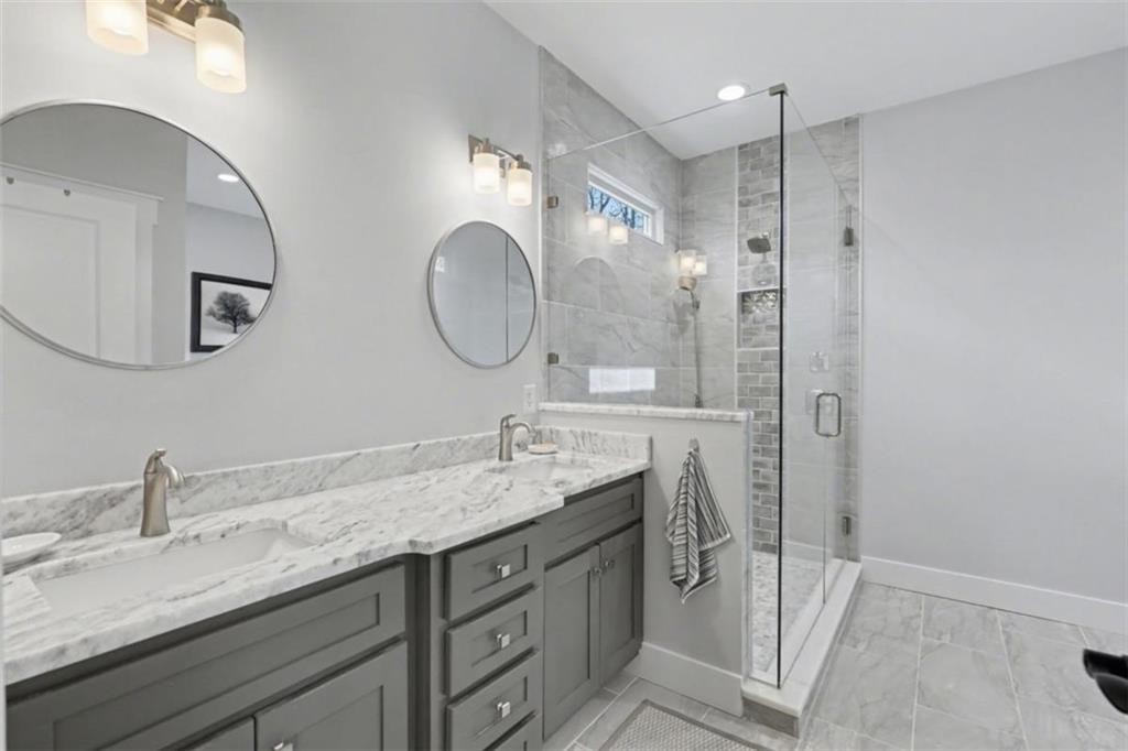 452 Chestnut Mountain Road Blairsville, GA 30512 - Photo 40 of 77 a bathroom with a granite countertop sink mirror and double
