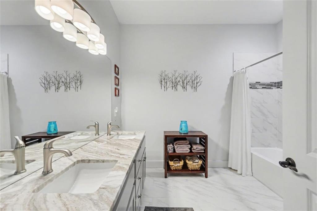 452 Chestnut Mountain Road Blairsville, GA 30512 - Photo 66 of 77 a bathroom with a sink and a mirror