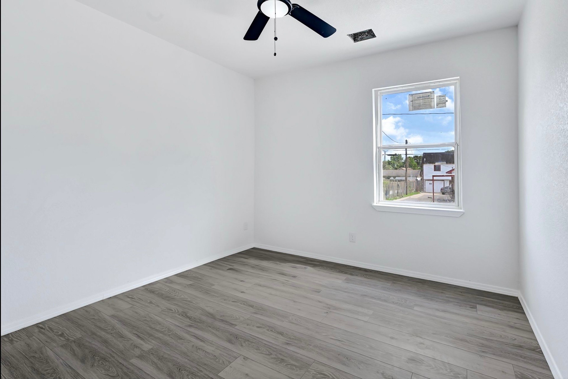 7939 Goode Street Houston, TX 77012 - Photo 12 of 13 wooden floor in an empty room