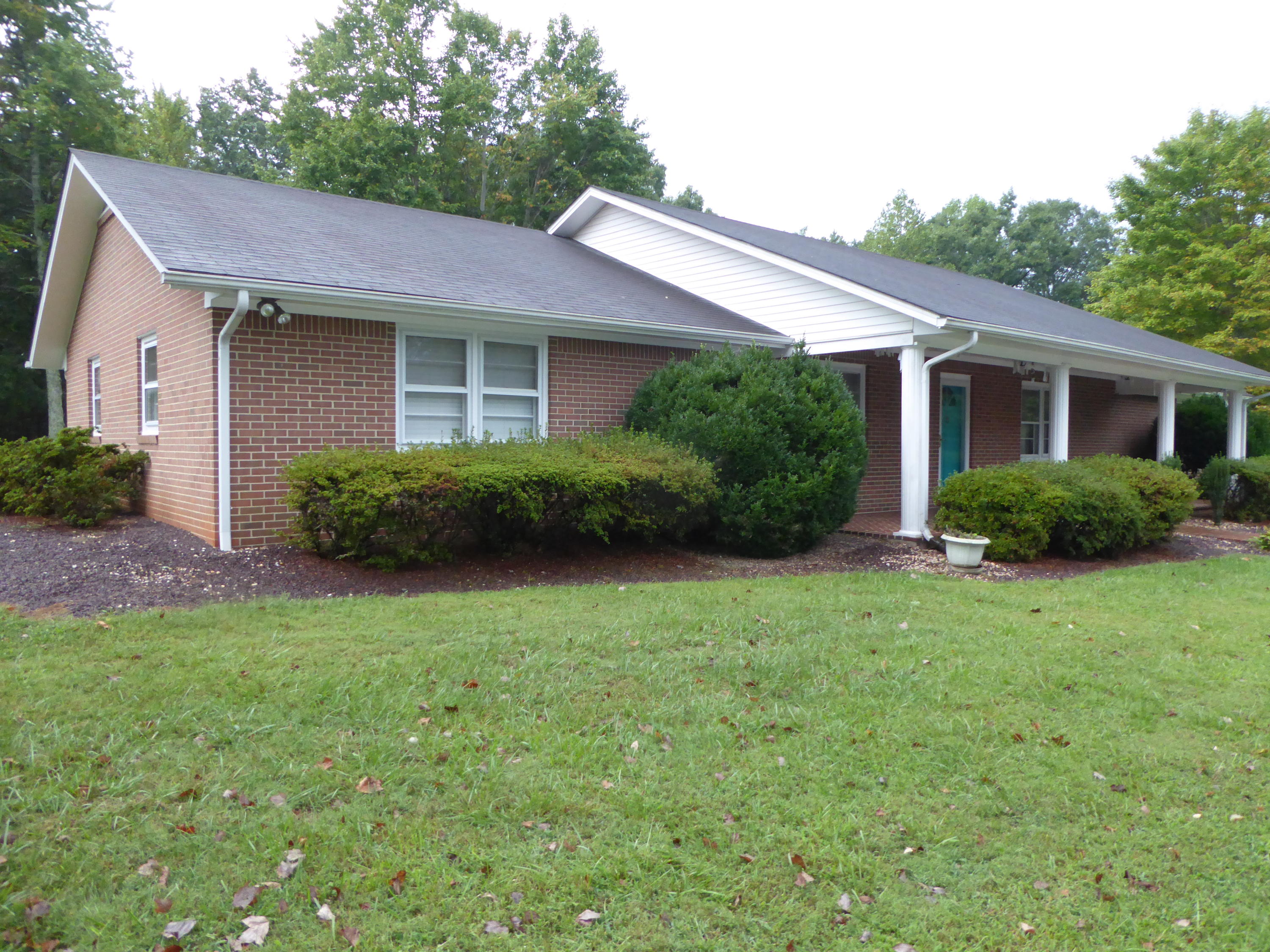 10454 Henry Road Henry, VA 24102 - Photo 1 of 72 a view of a house with a yard and plants