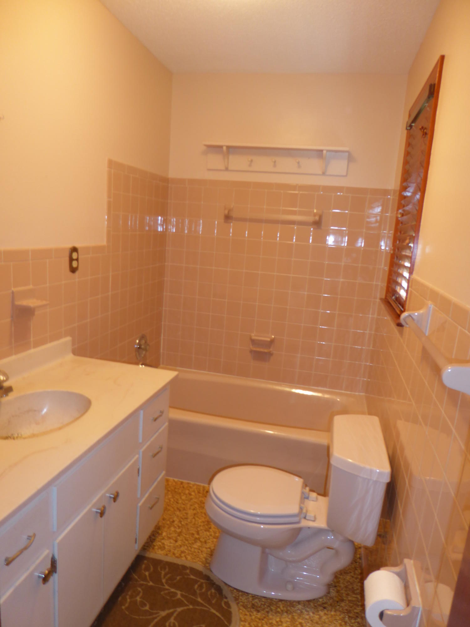 10454 Henry Road Henry, VA 24102 - Photo 16 of 72 a bathroom with a granite countertop toilet a sink and bathtub