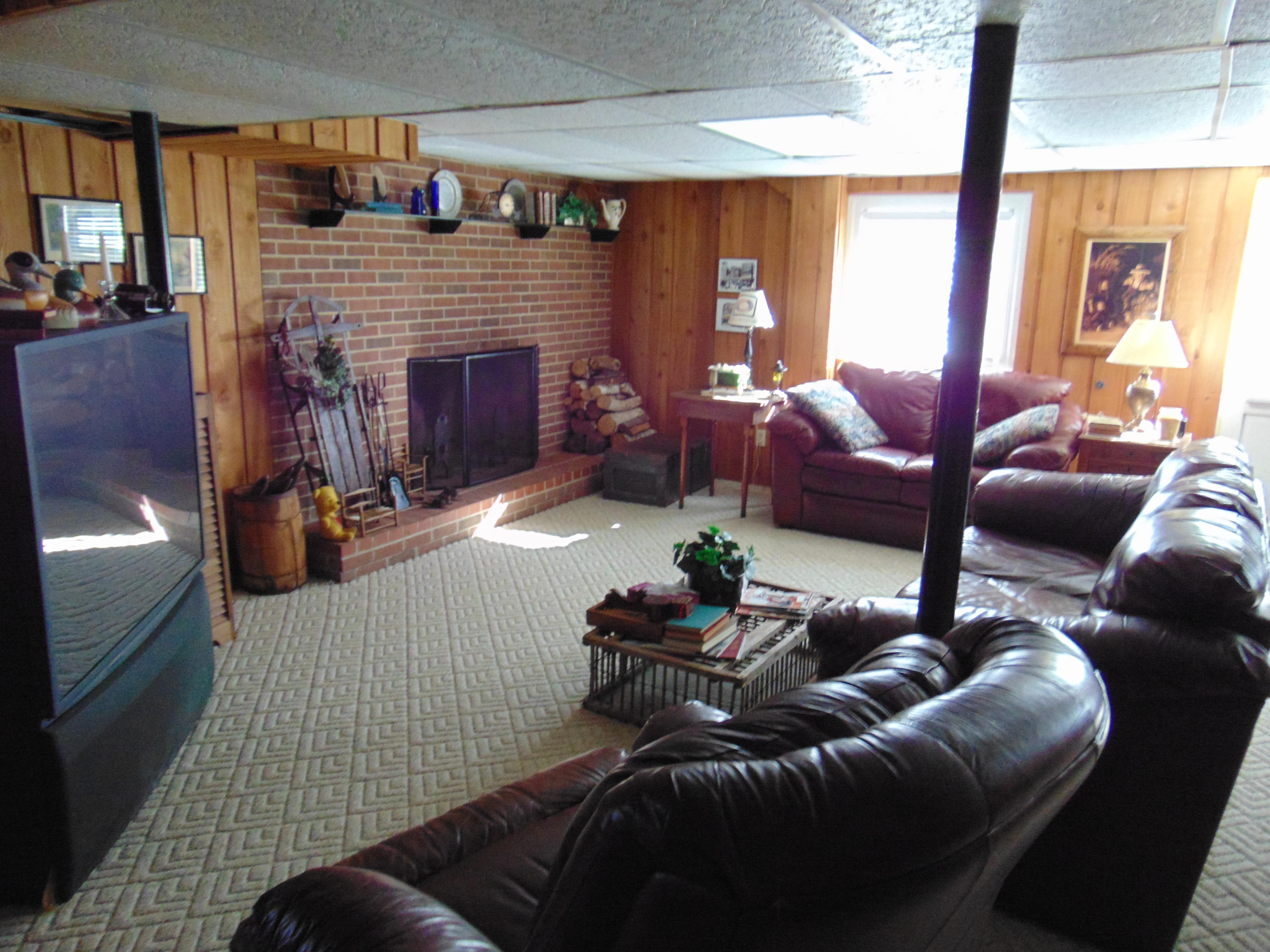 10454 Henry Road Henry, VA 24102 - Photo 25 of 72 a living room with furniture and a fireplace