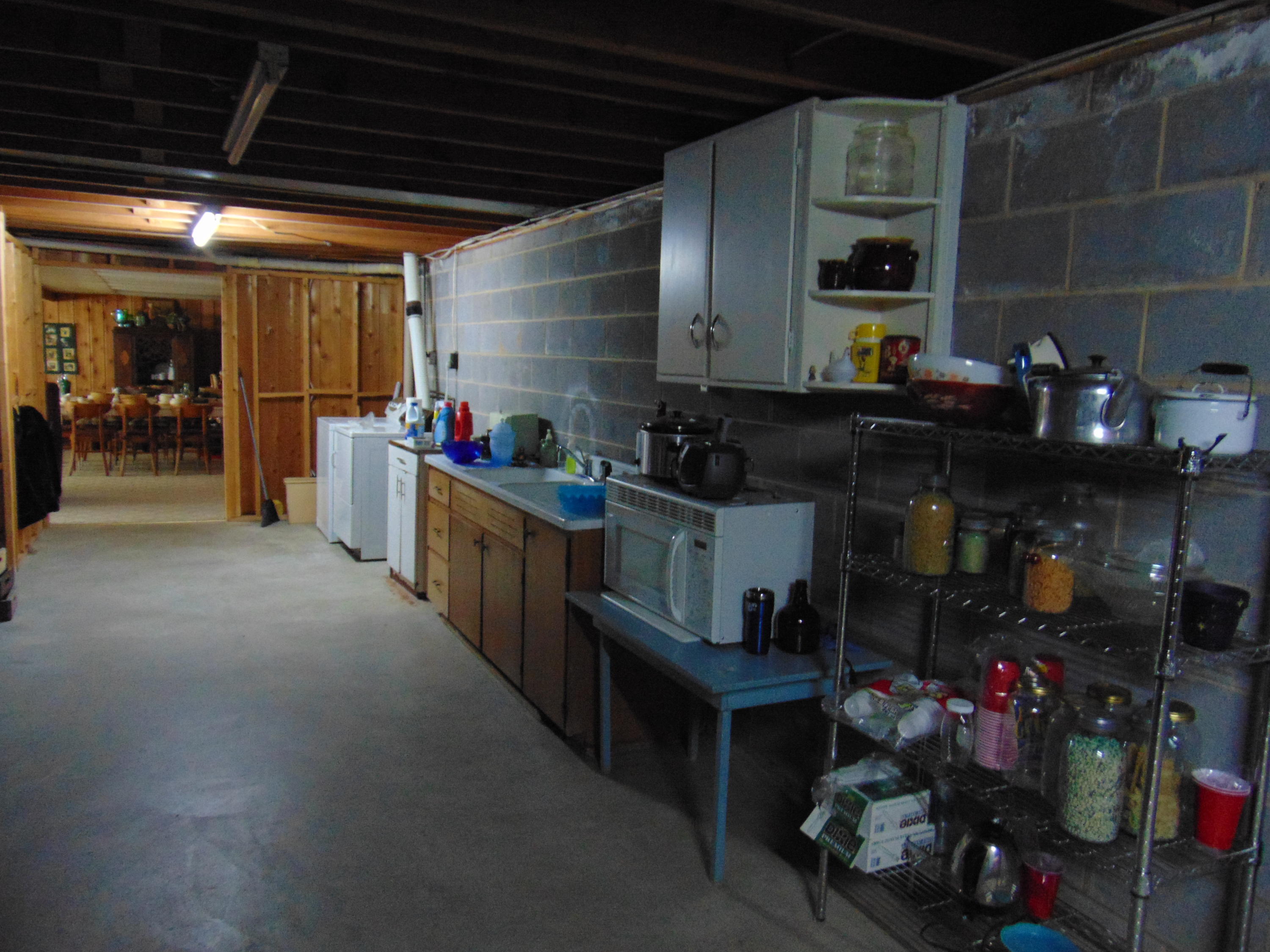 10454 Henry Road Henry, VA 24102 - Photo 26 of 72 a kitchen with lots of clutter and cabinets