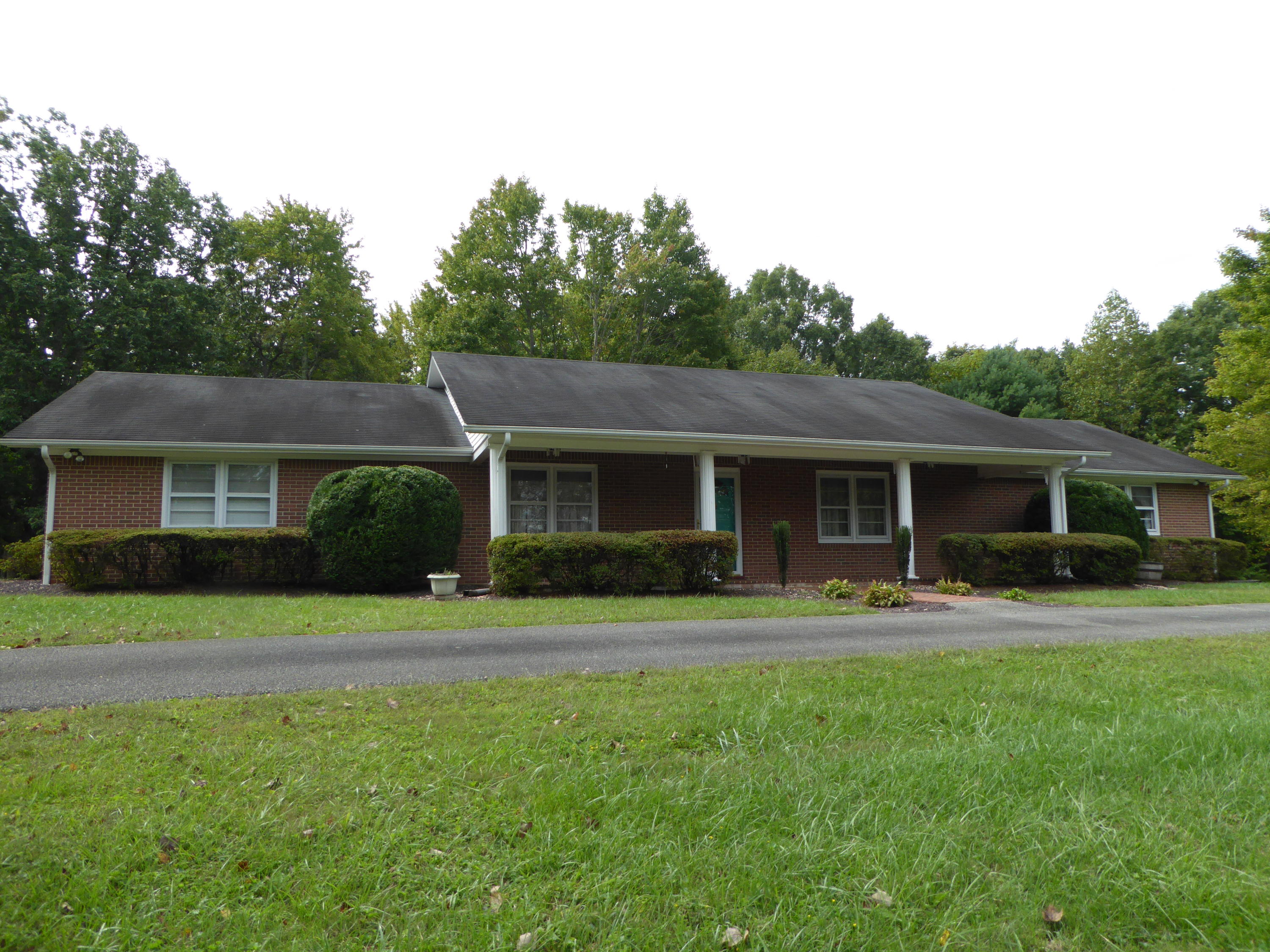 10454 Henry Road Henry, VA 24102 - Photo 48 of 72 a front view of a house with a yard and trees