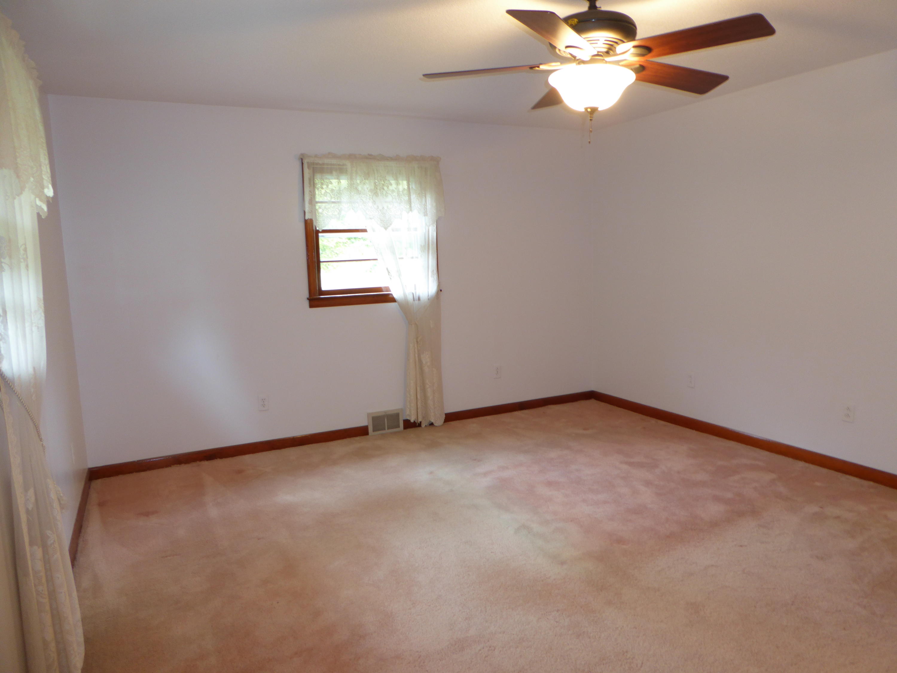 10454 Henry Road Henry, VA 24102 - Photo 54 of 72 an empty room with windows and fan