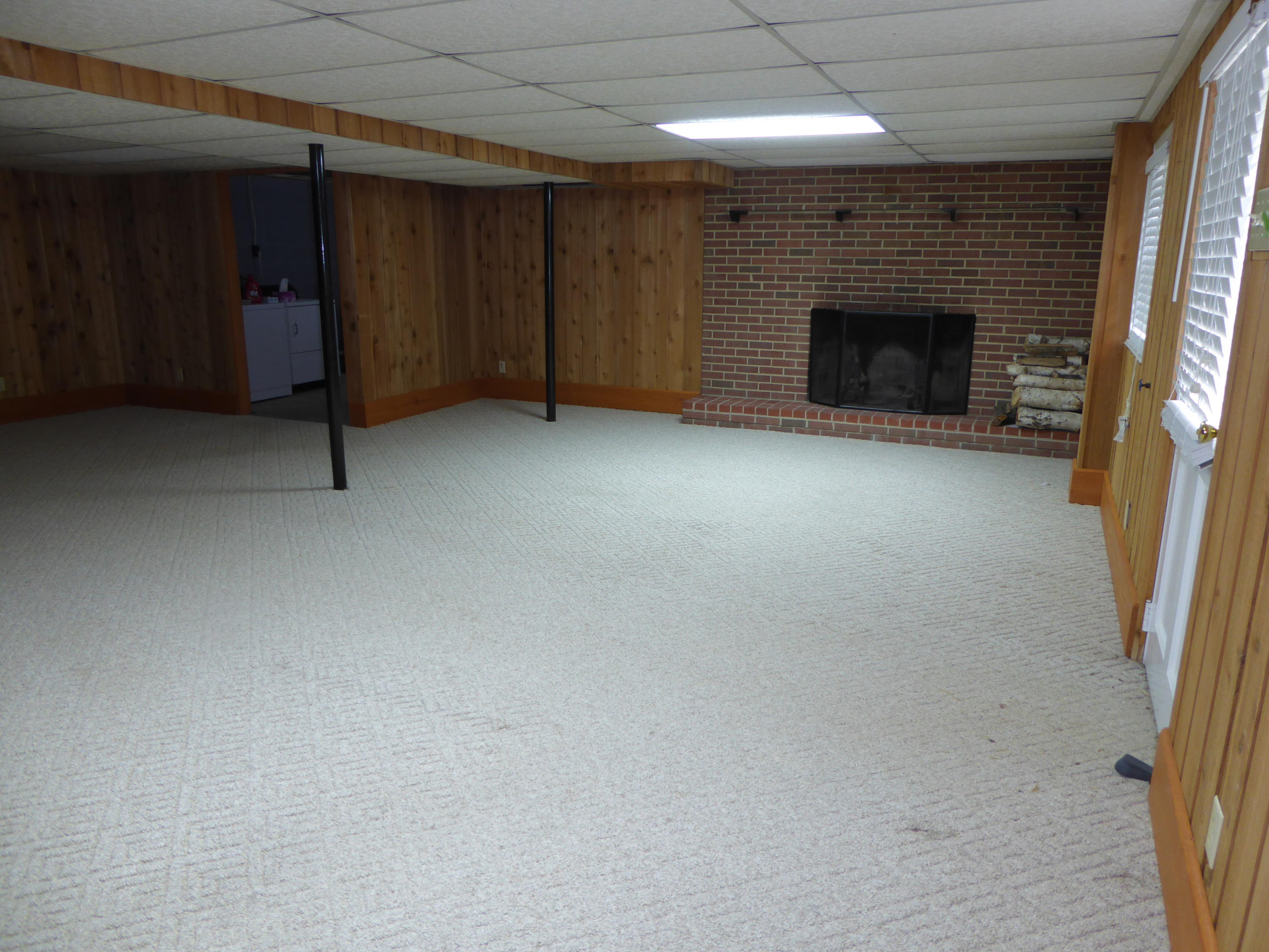 10454 Henry Road Henry, VA 24102 - Photo 64 of 72 an empty room with a fireplace