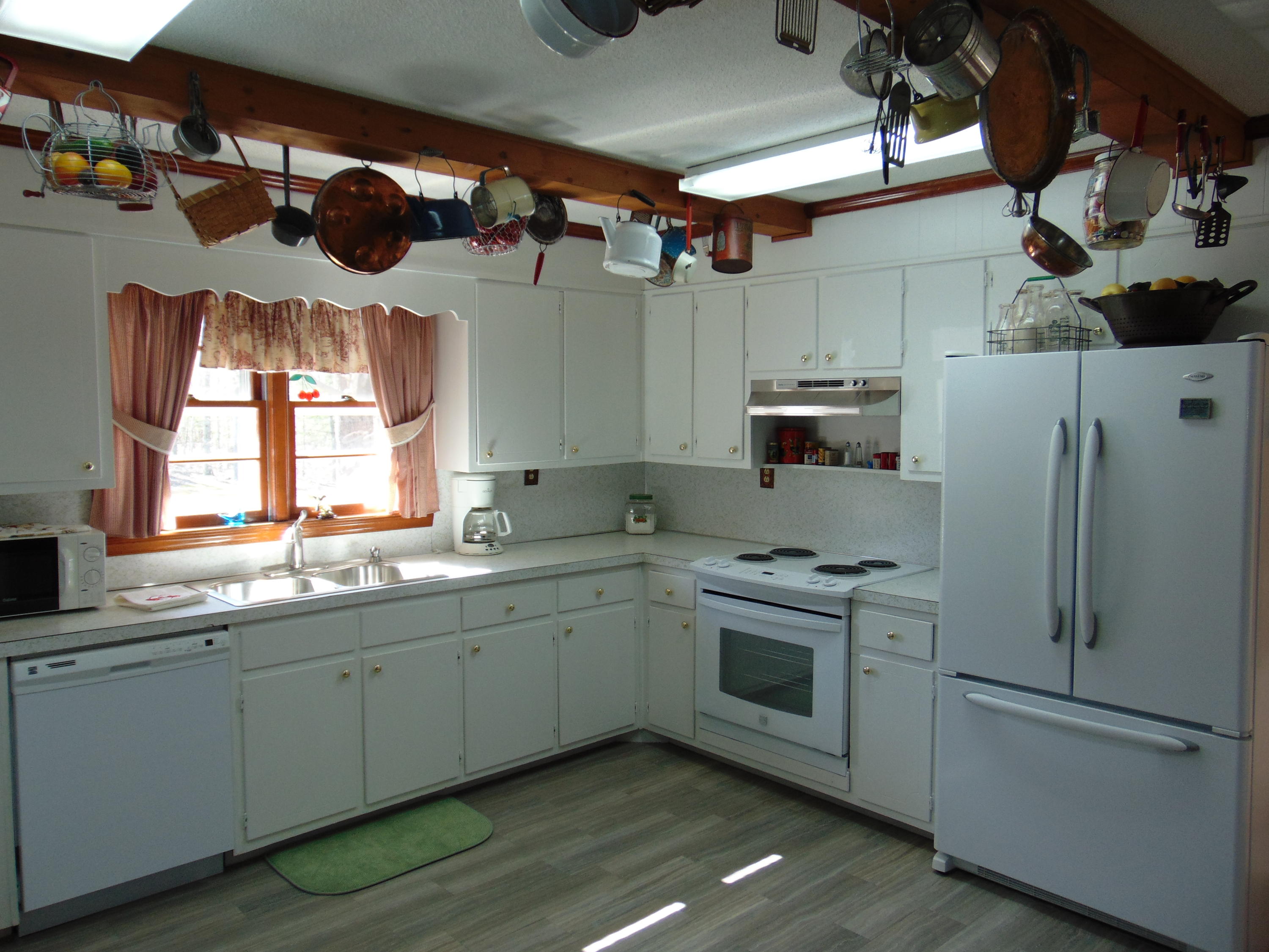10454 Henry Road Henry, VA 24102 - Photo 8 of 72 a kitchen with stainless steel appliances granite countertop a sink a stove and a refrigerator