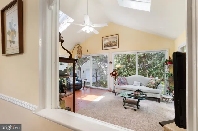 a bedroom with a bed a window and dresser