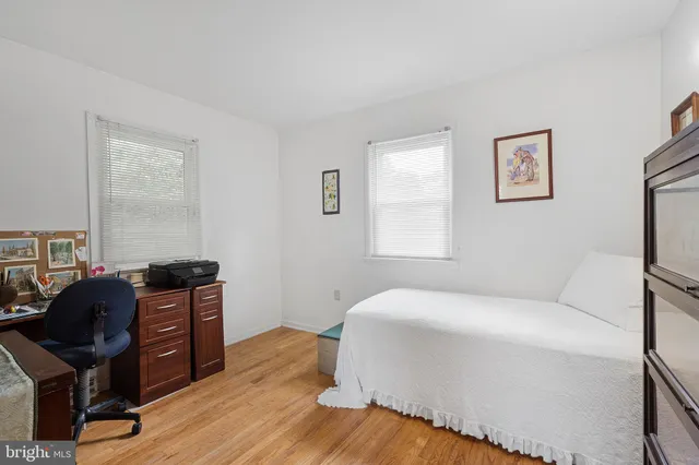 a bedroom with a bed and a chair