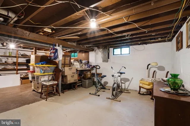 a view of storage and utility room with washer and dryer