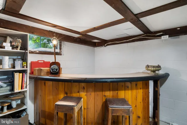 a view of a chair and table in the garden