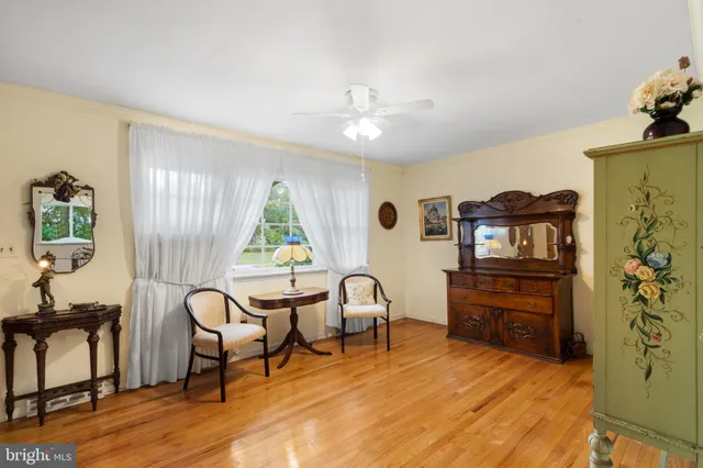 a view of a livingroom with furniture and a workspace
