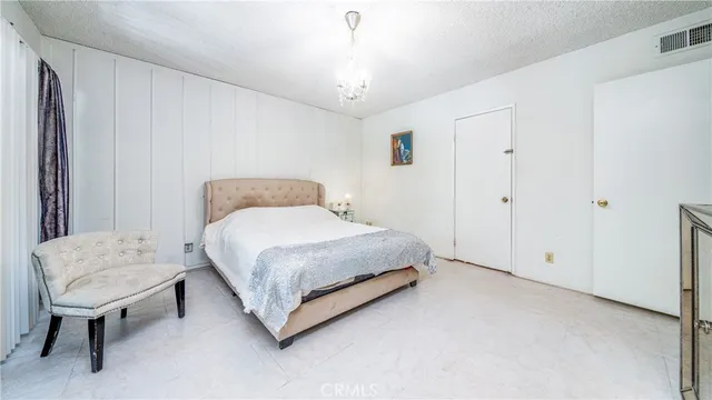 a view of walk in closet with clothes