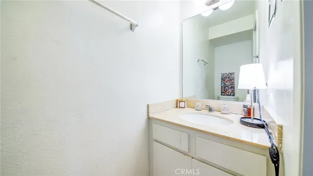 an empty room with a chandelier fan