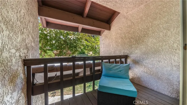 a living room with furniture and a clock