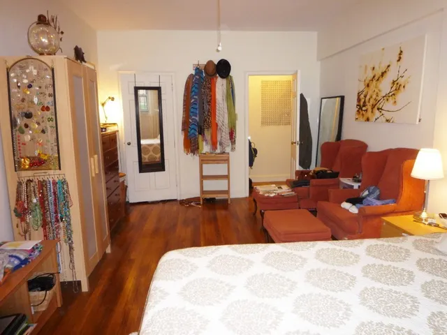 a bed room with a bed and a couch