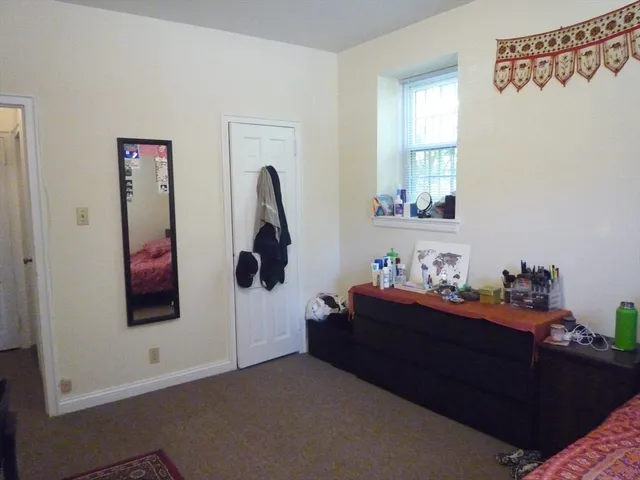 a room with furniture and mirror