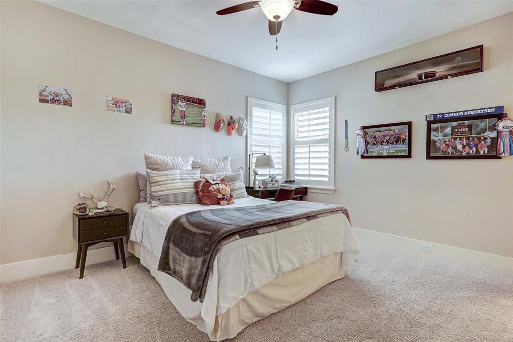 4501 Westlake Drive, Unit 23 Austin, TX 78746 - Photo 13 of 15 a bedroom with a bed and a chandelier