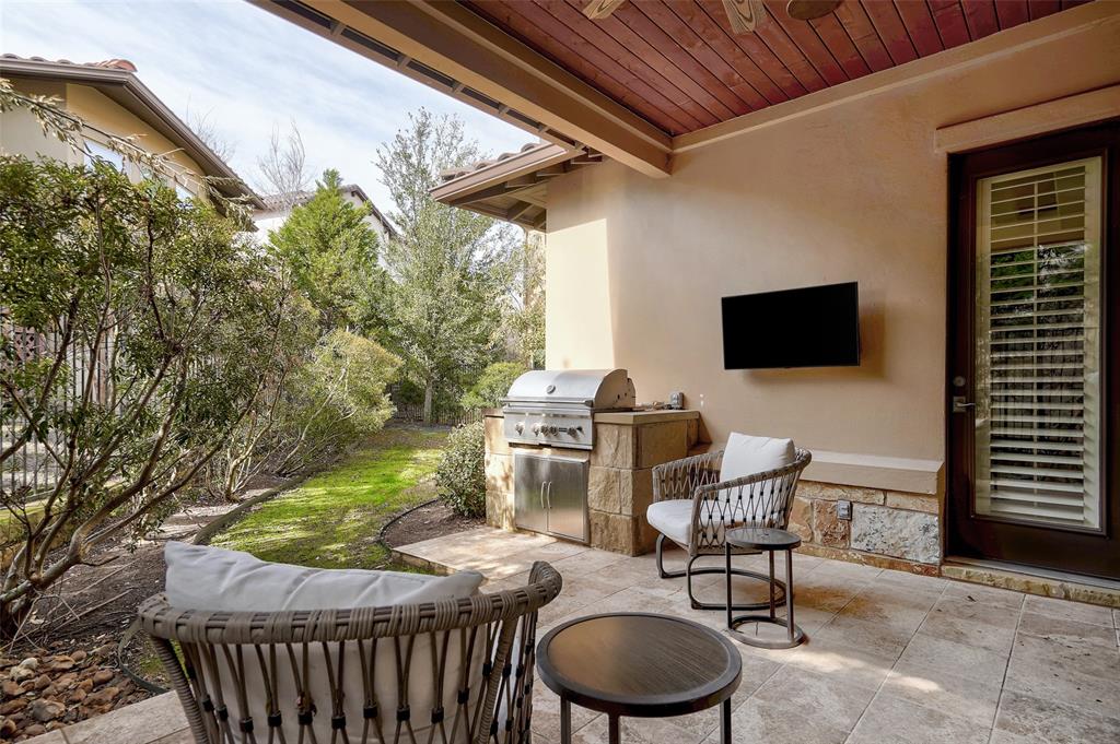 4501 Westlake Drive, Unit 23 Austin, TX 78746 - Photo 14 of 15 a backyard of a house with fire pit and outdoor seating