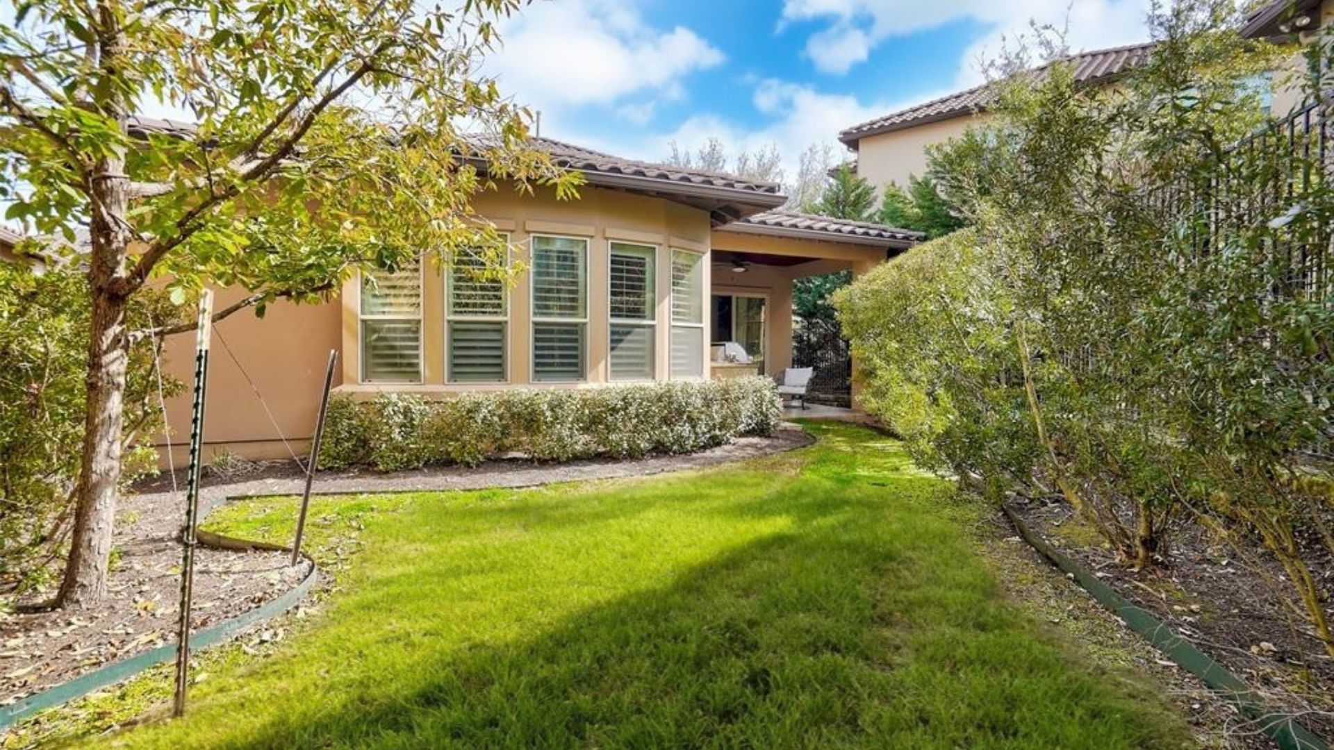 4501 Westlake Drive, Unit 23 Austin, TX 78746 - Photo 15 of 15 a view of a house with a yard and potted plants