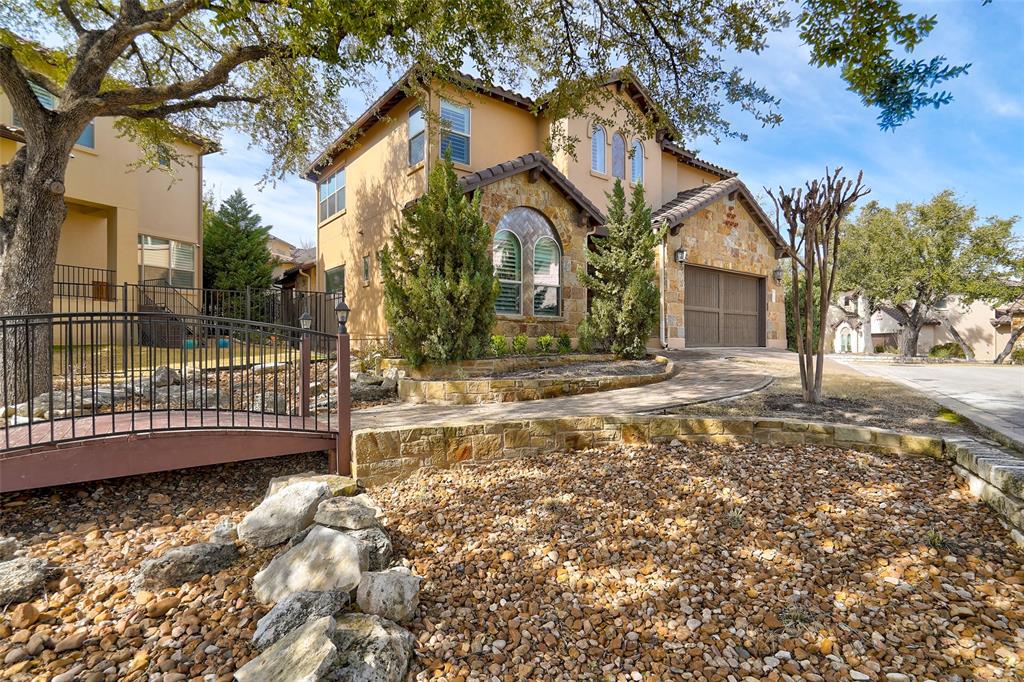 4501 Westlake Drive, Unit 23 Austin, TX 78746 - Photo 2 of 15 a front view of a house with a yard