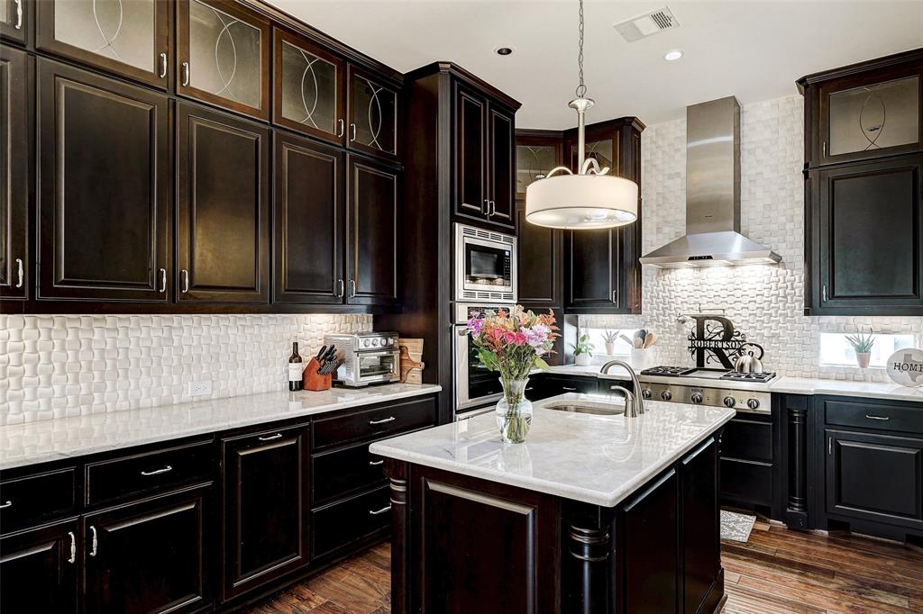 4501 Westlake Drive, Unit 23 Austin, TX 78746 - Photo 5 of 15 a kitchen with stainless steel appliances a sink stove and refrigerator